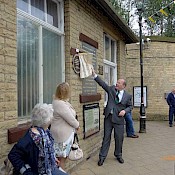 The plaque being unveiled